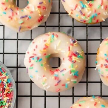 baked vanilla donuts on a cooling rack