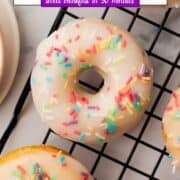 baked vanilla donuts on a wire rack