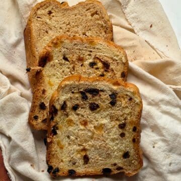 bread maker cinnamon raisin bread sliced on a cheesecloth