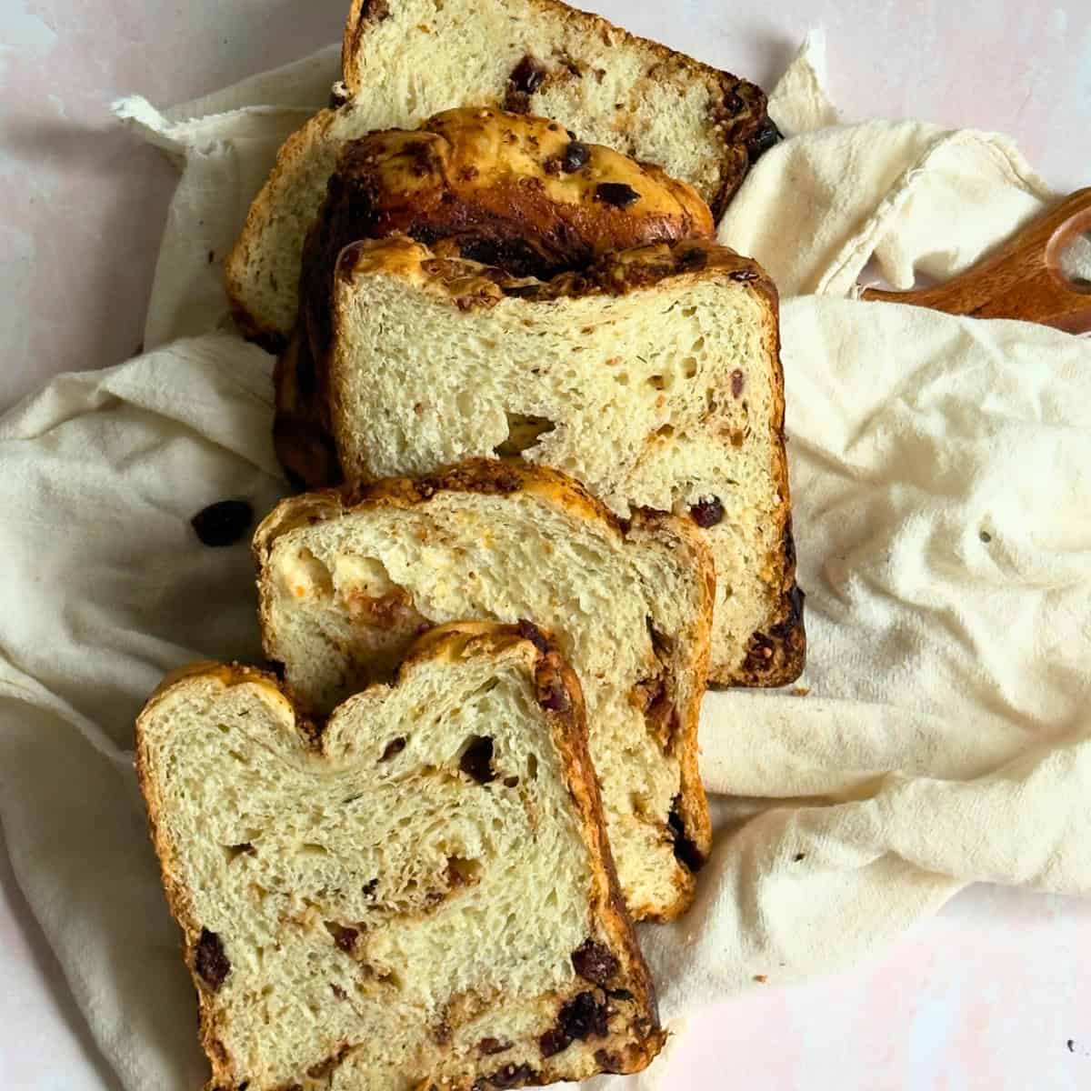 bread machine cranberry cheese bread slices on a cheesecloth