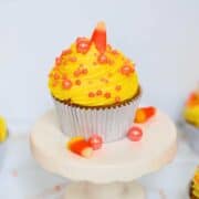 candy corn cupcakes on a white plate