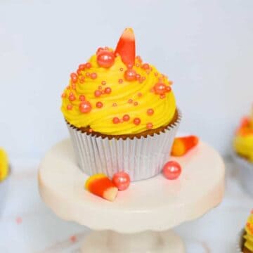 candy corn cupcakes on a white plate