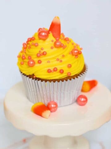 candy corn cupcakes on a white plate