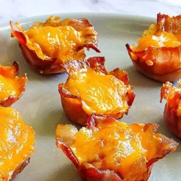 bacon wrapped tater tot cups on a plate
