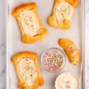 crescent roll cream cheese danish on a baking sheet