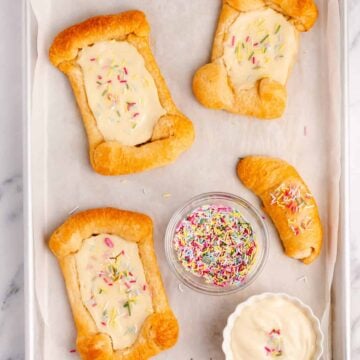 crescent roll cream cheese danish on a baking sheet