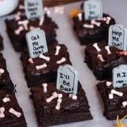 sliced halloween graveyard brownies on parchment paper