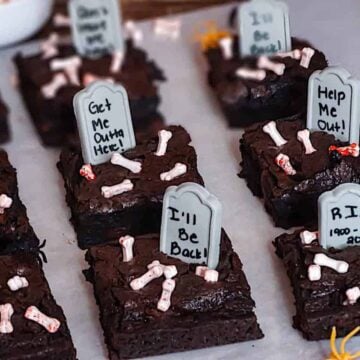 sliced halloween graveyard brownies on parchment paper