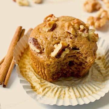 honey cinnamon walnut muffin cut open on a cooling rack