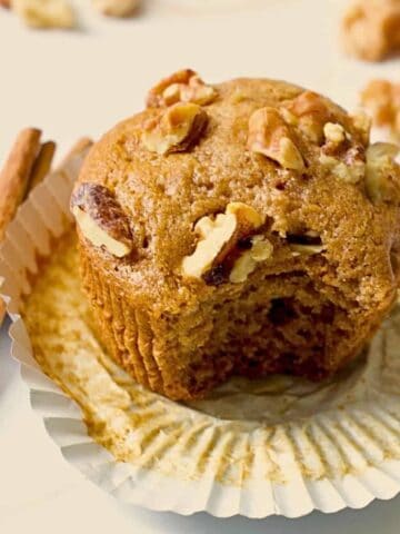 honey cinnamon walnut muffin cut open on a cooling rack