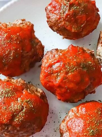 mini muffin shaped meatloaf on a white plate