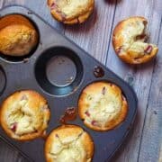 strawberry cream cheese muffins in a muffin pan