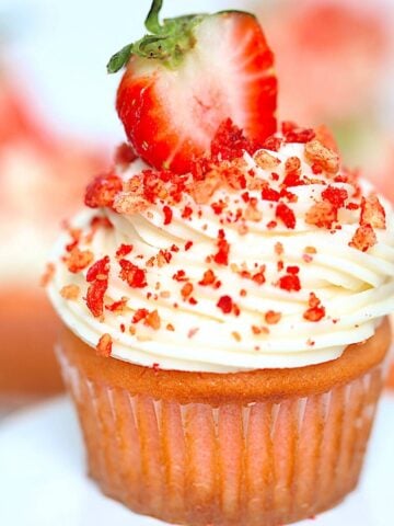 strawberry crunch cupcake on a white plate