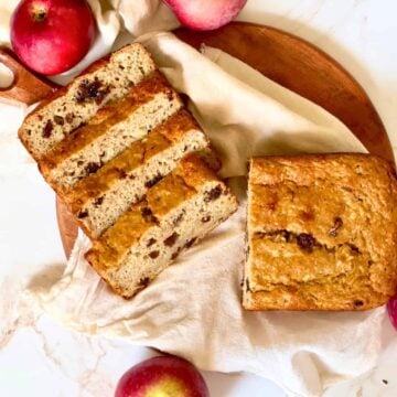 apple raisin bread sliced on a cutting board