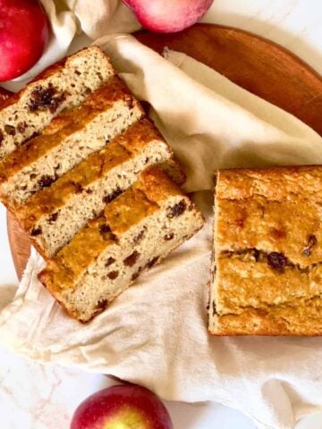 apple raisin bread sliced on a cutting board
