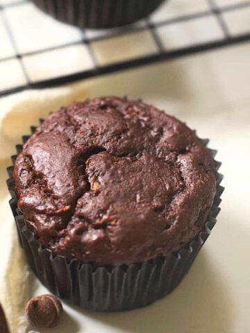 double chocolate zucchini muffins on a counter
