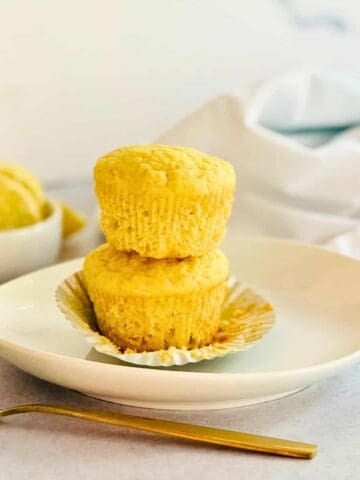 lemon muffins in a stack on a plate