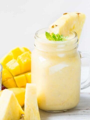 mango pineapple smoothie in a glass