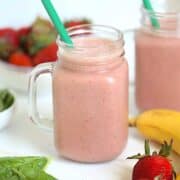 hidden spinach strawberry smoothie in a mason jar