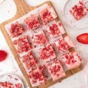 strawberry brownies sliced on a cutting board
