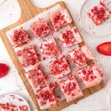 strawberry brownies sliced on a cutting board