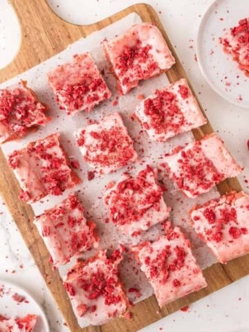 strawberry brownies sliced on a cutting board