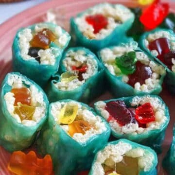 rice krispie candy sushi rolls on a pink plate