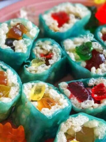 rice krispie candy sushi rolls on a pink plate